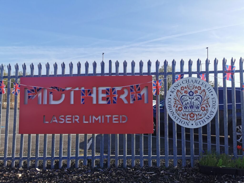The Kings Coronation panel on the gates at Midtherm Laser
