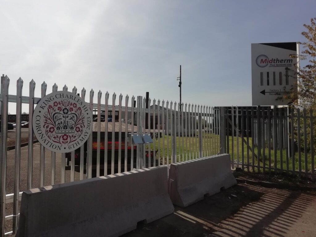 The Kings Coronation panel on the gates at Midtherm Flues