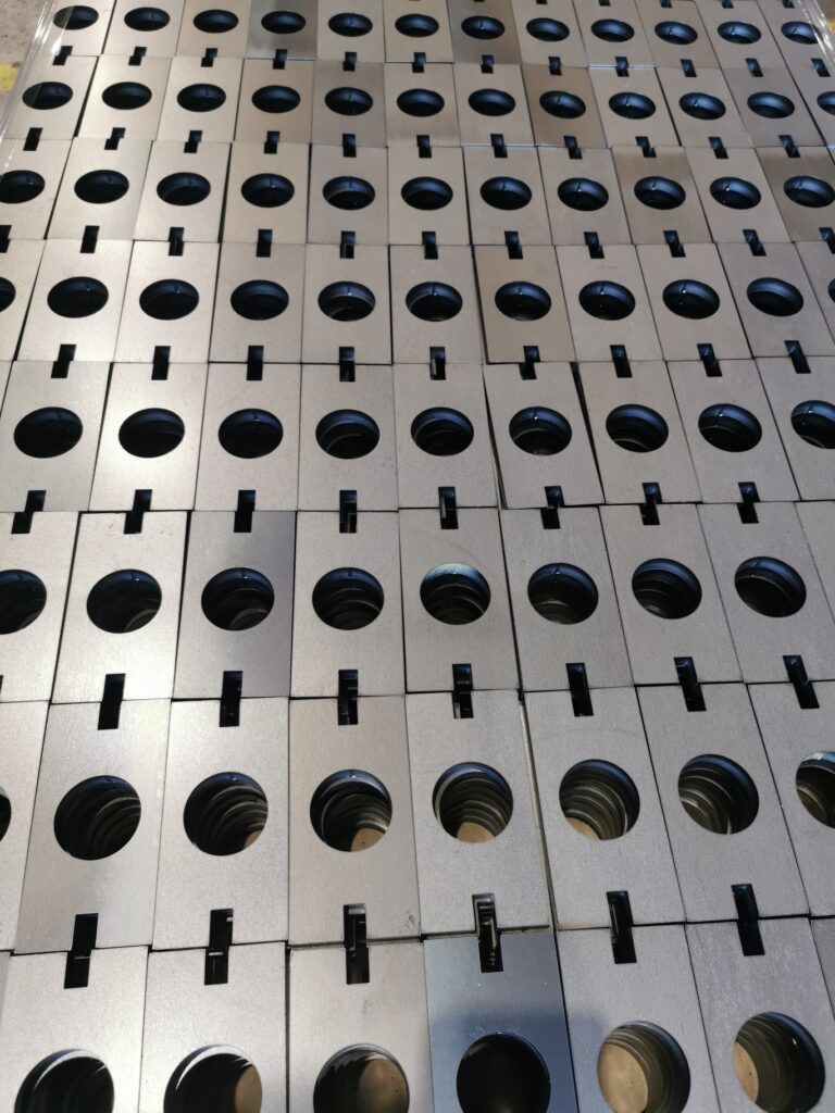 Mild steel parts on laser bed
