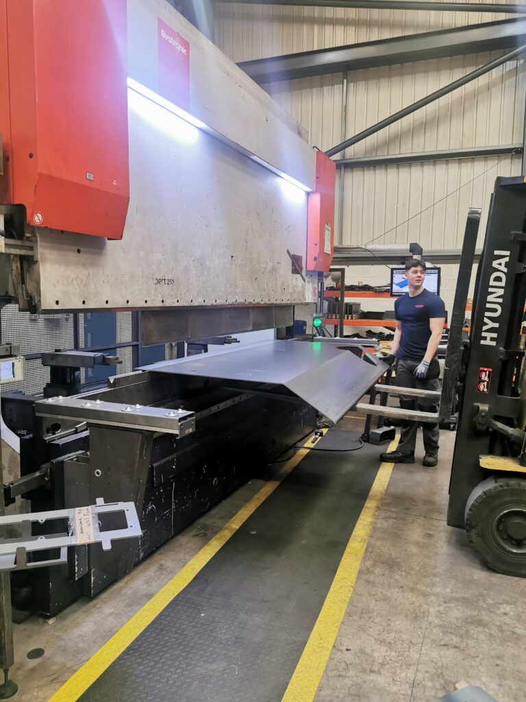 Huge metal plate formed using the 250T press and the forklift