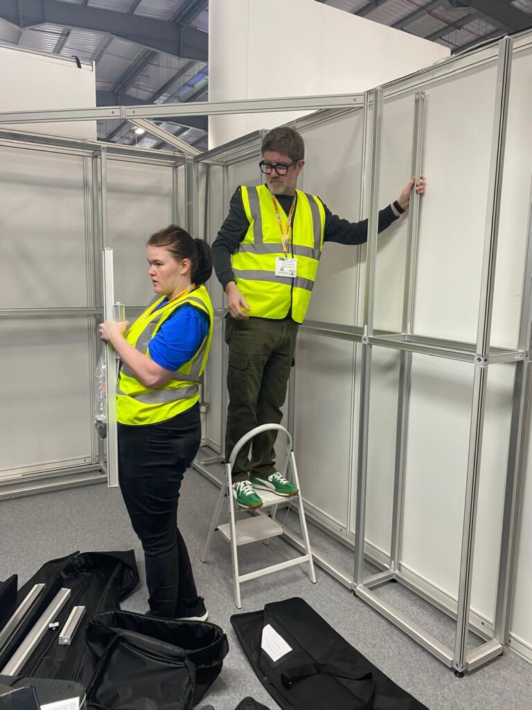 this photo shows the team setting up the stand ready for Farnborough