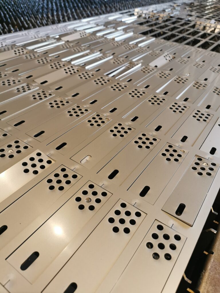 A photo to show lots of parts on the machine bed showcasing Precision and Repeatability in Everyday Parts
