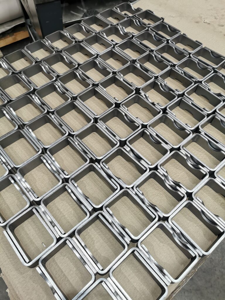 A photo of parts on a pallet showcasing repeated forming