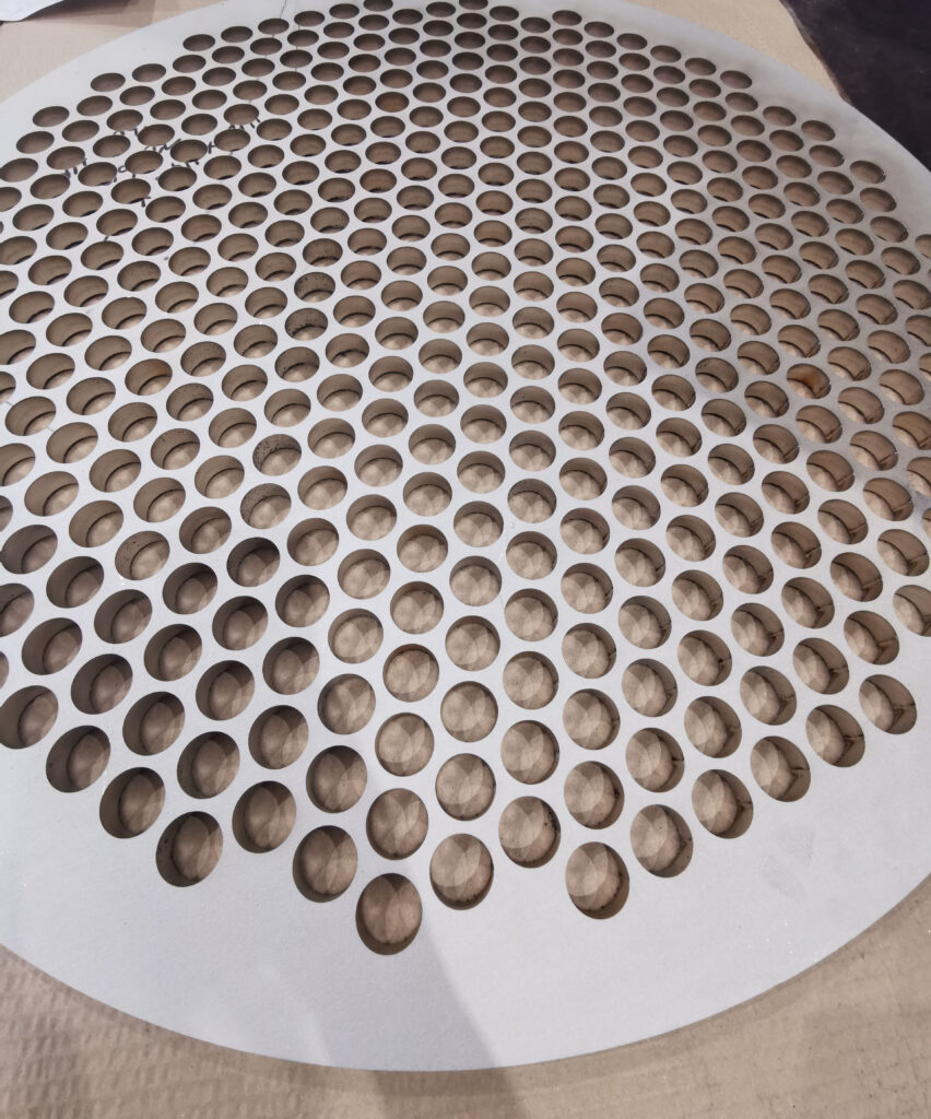 An image showing Common Laser Cutting Questions Answered - tolerances of a perforated panel