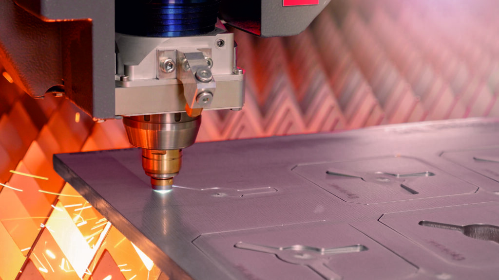 An image showing the laser head cutting