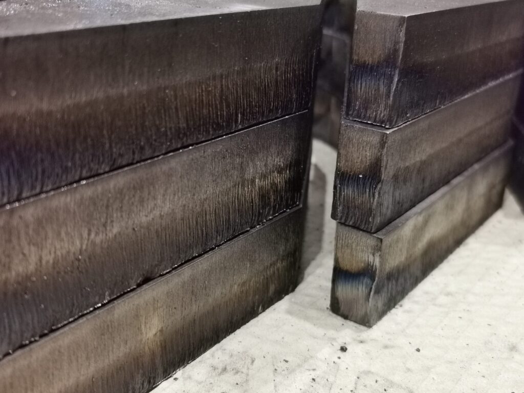 An image showing a 30mm mild steel plate laser cut at Midtherm Laser limited with edge striations from the laser beam