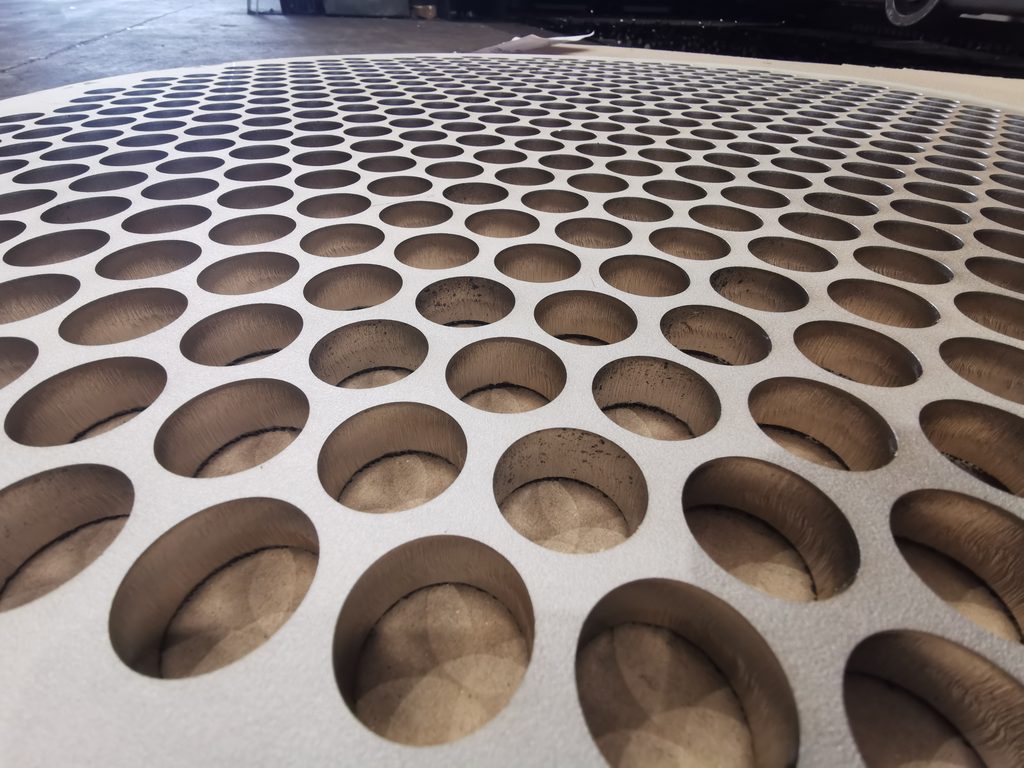 An image showing the edge of some 15mm 304 stainless steel sheet after its been laser cut using a fiber laser
